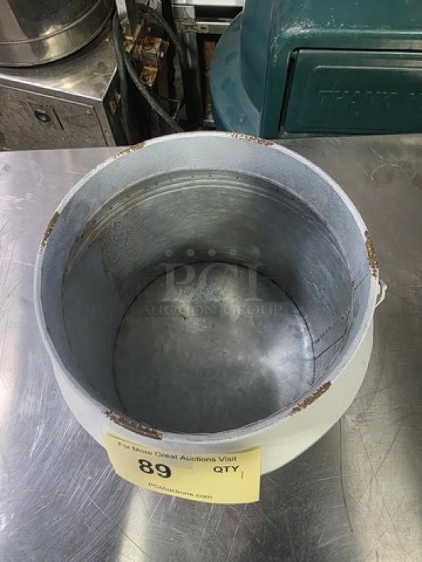 Galvanized dairy bucket, cylindrical shape, metal construction, visible wear on rim, label "89", auction item.