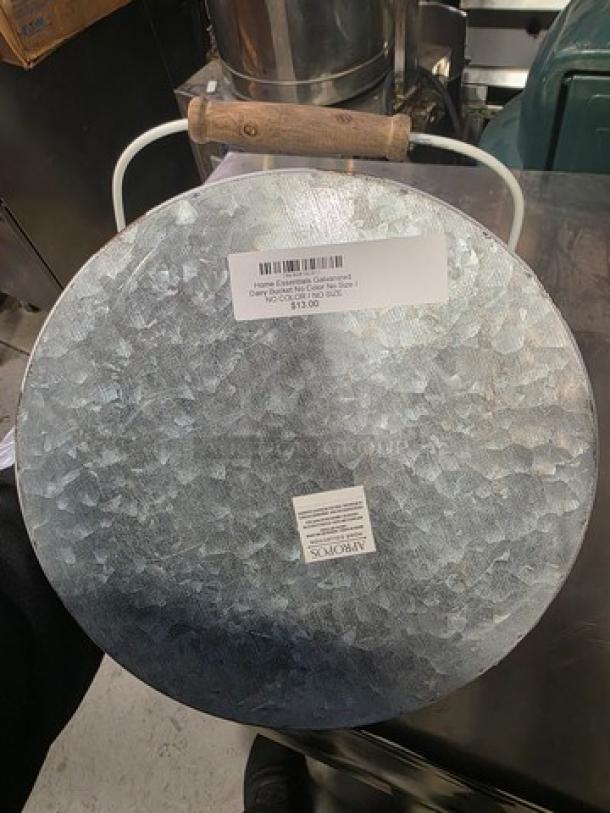 Galvanized dairy bucket with wooden handle, metallic finish, Avery label indicating $13.00 price.