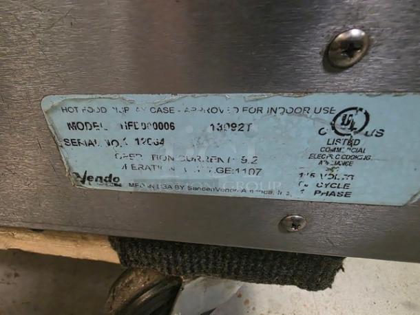 Vendo HFD000006 35" Hot Food Display Case, silver finish, model label showing serial no. 12094, in fair condition.