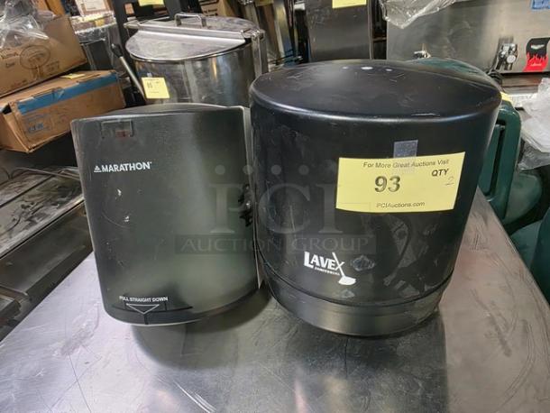 Lot of 2 paper towel dispensers: Marathon and Lavey brands. Black, used condition. Auction label 93, Qty 2.