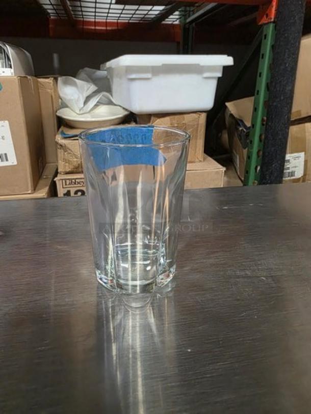 Anchor Hocking 12 oz Clarisse beverage glass, rim-tempered, model 77792R, displayed on a metal shelf.