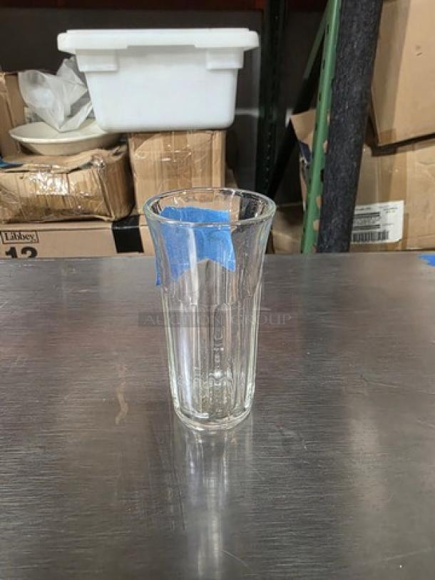 Two boxes of 4 oz juice glasses, clear glass with vertical lines, excellent condition, ideal for beverages.