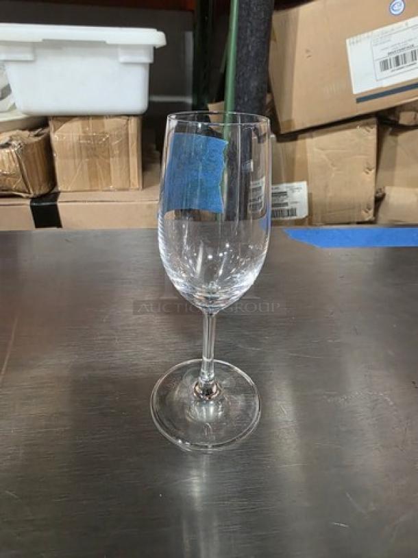Schott Zwiesel sherry glass, clear crystal, sleek design, excellent condition, displayed on a metal surface.