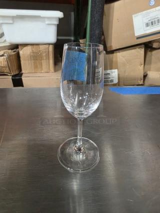 Schott Zwiesel sherry glass, clear crystal, sleek design, excellent condition, displayed on a metal surface.