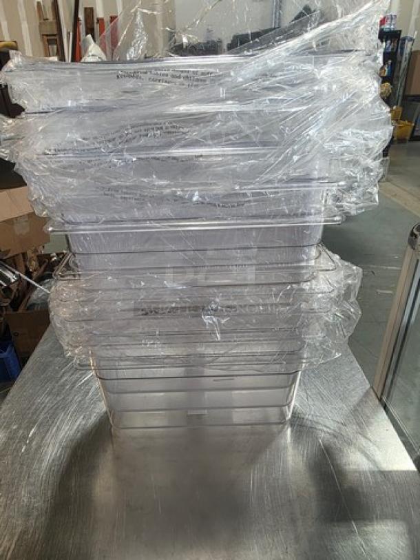 Lot of 10 Winco plastic food pans, stacked, wrapped in plastic, new condition. Ideal for commercial kitchen use.