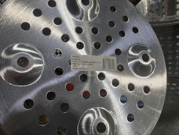 Lot of 2 Winco aluminum steamer baskets, new condition, perforated design, fits 40 qt. stock pot, visible label reads "Made in China."