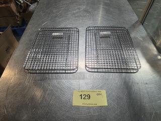 Lot of 2 Winco pan grates on a metal surface, item number 129, in good condition.