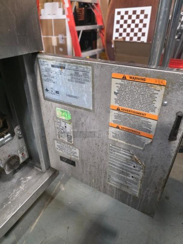 Pitco Natural Gas Floor Fryer, Model 35C+, 35lbs capacity, 90,000 BTU. Visible warning labels and specifications.
