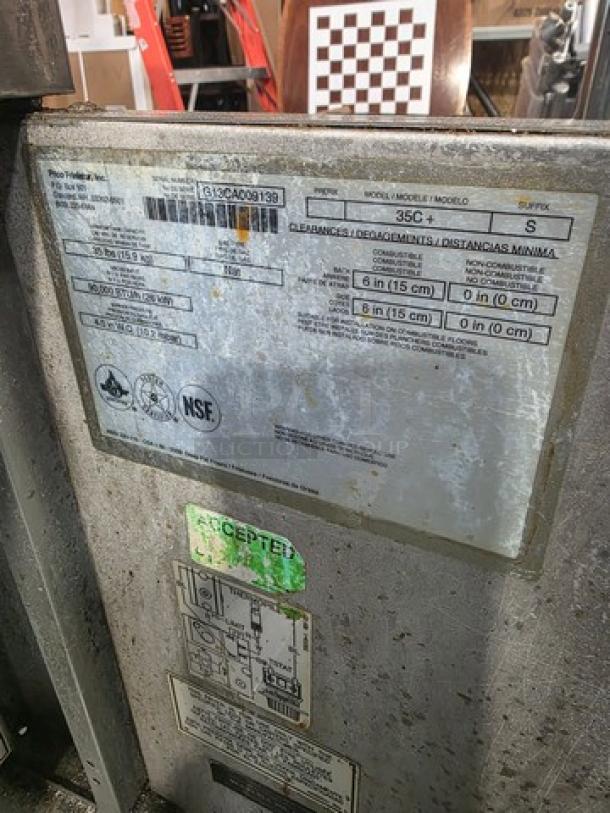 Pitco Natural Gas Floor Fryer, Model 35C+, 35lbs capacity, 90,000 BTU. Labels show specifications and NSF certification.