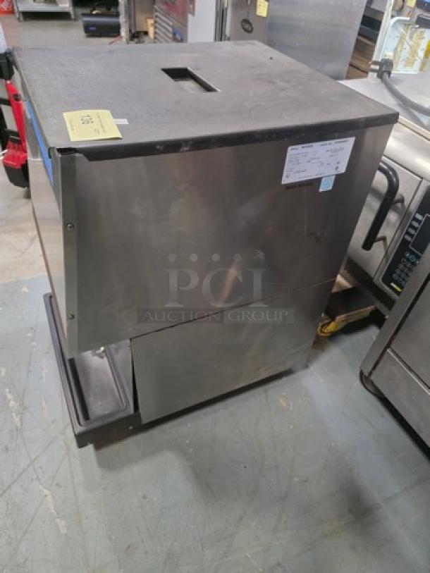 Manitowoc MFD50S ice cube dispenser, stainless steel, 115V, 60Hz, 1 PH, in used condition with visible tags and labels.