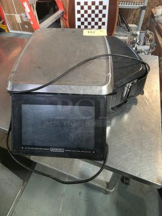 Hobart HT Series HTS-7ELS price computing scale with slightly cracked screen, stainless steel body, visible Hobart branding.