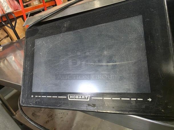 Hobart HT Series HTS-7ELS price computing scale, screen slightly cracked, black casing, Hobart logo visible.