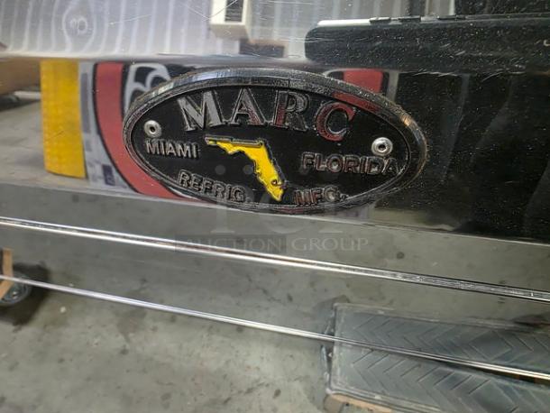 Marc Refrigeration display tag, showing "Miami Florida Refrig Mfg" with a Florida outline. Durable metal tag condition.