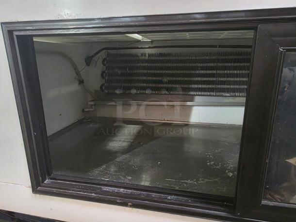 Marc Refrigeration 94" meat display unit, self-contained, interior shelving visible, used condition, ideal for butcher shops.