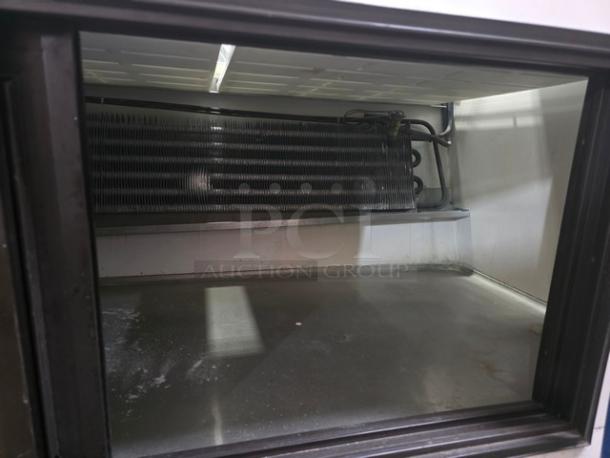 Marc Refrigeration 94" self-contained butcher meat display, interior view showing cooling unit, clean and well-maintained.