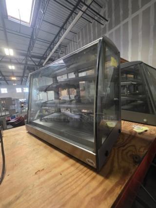 Sanden Vendo Hot Food Display Case, Model HFD000006. 115V, 1PH. Clear glass with stainless steel frame, in a warehouse setting.