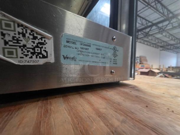 Sanden Vendo Hot Food Display Case, Model HFD000006, 115V, 1PH. Silver finish with visible label and QR code.