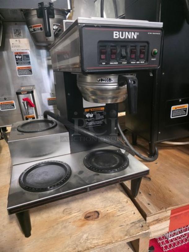 Bunn coffee maker with 4 warmers, used condition, visible control panel, black and silver finish, commercial model.