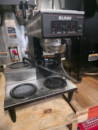 Bunn coffee maker with 4 warmers, used condition, visible control panel, black and silver finish, commercial model.