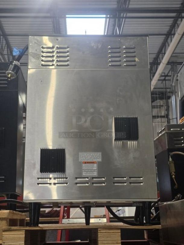 Bunn Digital Brew Dual TFC Coffee Maker, model 34600.0039, stainless steel, 120/208-240V, in good condition, industrial setting.