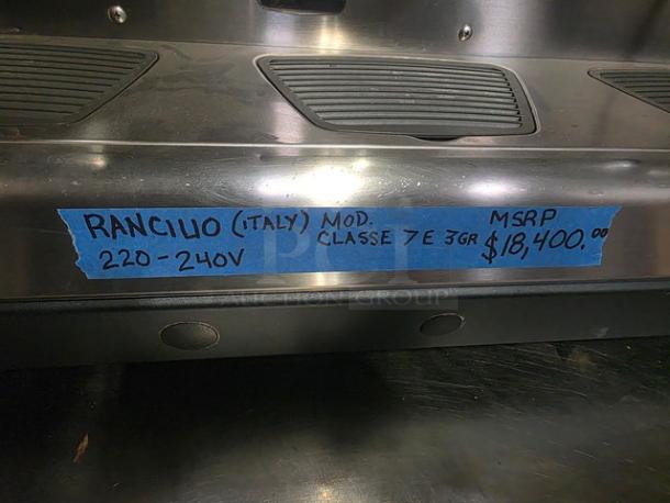 Rancilio CLASSE 7E 3GR automatic espresso machine, 220-240V. Blue tape label shows MSRP $18,400. Made in Italy.