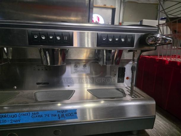 Rancilio CLASSE 7E 3GR automatic espresso machine, stainless steel, 220-240V, three group heads, with control panel buttons.