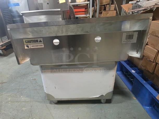 Steelton 24" stainless steel one compartment commercial sink, model 522CS11818N, no legs, caution label visible, good condition.