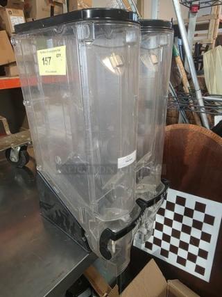 Lot of two 5-gallon gravity bin food dispensers in clear plastic, with black lids and levers. Lightly used condition.