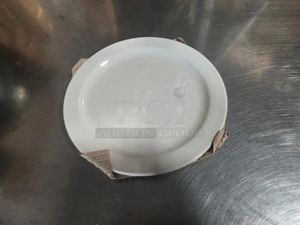 Lot of 23 white 8" round plates, displayed with one on top. Plates appear in good condition, stacked on stainless surface.