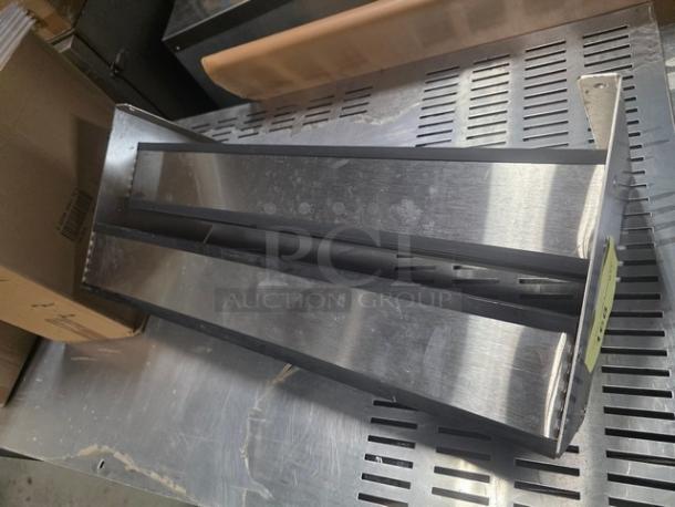 Stainless steel double speed rail in excellent condition, featuring dual compartments for efficient bottle storage.