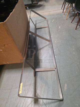 Wall mountable pot rack, stainless steel, rectangular frame, sturdy design, good condition, ideal for kitchen organization.