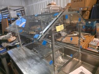 Glass sneeze guard for steam table, in good condition, with metal frame and mounting hardware. Steam table not included.
