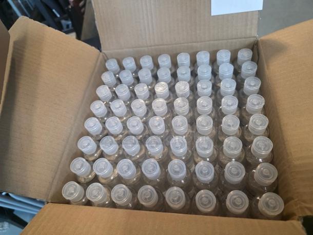 Open box containing multiple 2oz hand sanitizer bottles neatly arranged. Lot of 10 boxes available for auction.