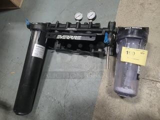 Pentair Everpure Commercial Water Filtration System with dual gauge, scale inhibitor. Black mount, good condition.