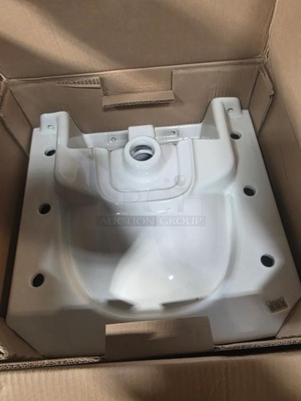 Wall mount lavatory, white ceramic, new in packaging. Features rounded basin and pre-drilled holes for installation.