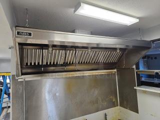 Naks 6ft commercial kitchen exhaust hood with fire suppression system, stainless steel finish, used condition. Marked "naks" on front.