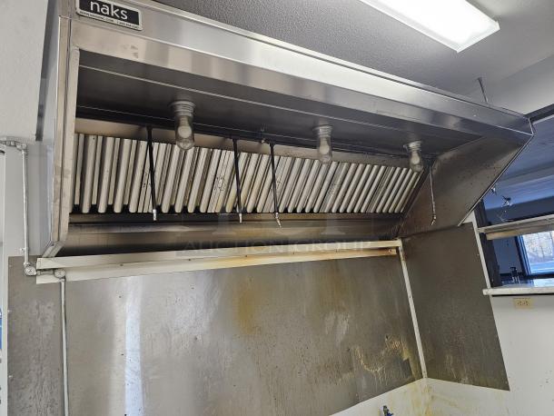 Naks 6ft commercial kitchen exhaust hood with fire suppression system, stainless steel, good condition, visible grease buildup.