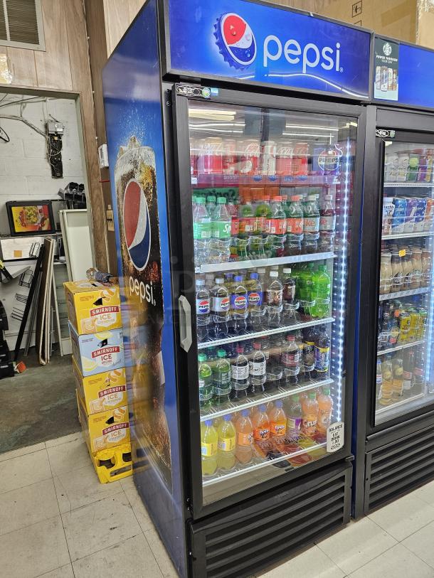 Single door Pepsi merchandiser, showcasing various beverages. Tested and working. Glass front with Pepsi branding.