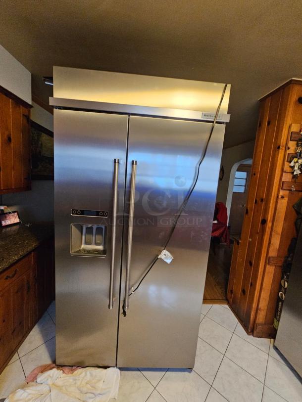 KitchenAid residential refrigerator, stainless steel, dual doors, with water dispenser. Tested, working; ice maker not functional.