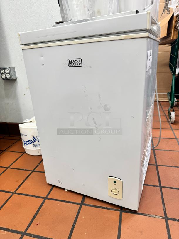 Black+Decker chest freezer, model BCFK356, white finish, visible minor scuffs, adjustable thermostat, good condition.