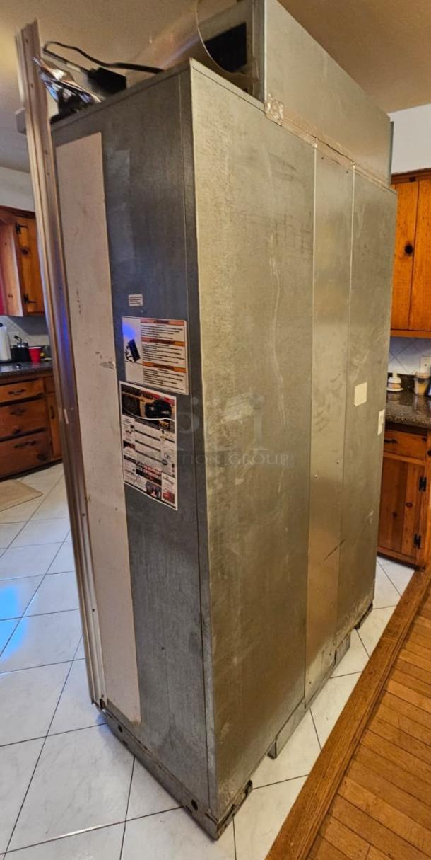 KitchenAid Residential Refrigerator, tested and working. Ice maker not functioning. Visible labels indicate maintenance info.