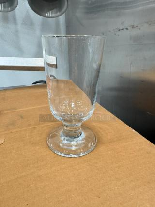 Lot of 36 highball glasses; clear glass, pedestal base, modern design. Excellent condition, ideal for entertaining.