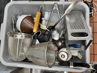 Bin of miscellaneous kitchenware including a grater, funnels, strainers, and utensils. Various conditions. All for one price.