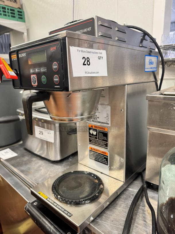 BUNN Axiom commercial coffee brewer, digital controls, stainless steel, warning labels, good condition. Model: Axiom.
