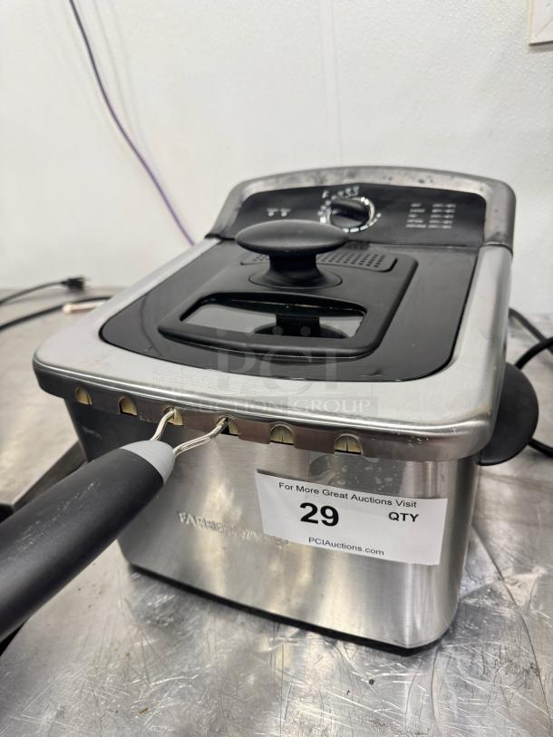 Farberware 4-liter deep fryer in stainless steel, featuring temperature control dial. Auction tag labeled "29 QTY."