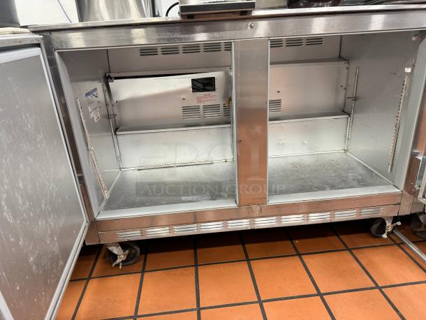 Beverage-Air 48" two-door undercounter refrigerator, tested and working, open showing interior shelves, stainless steel finish.
