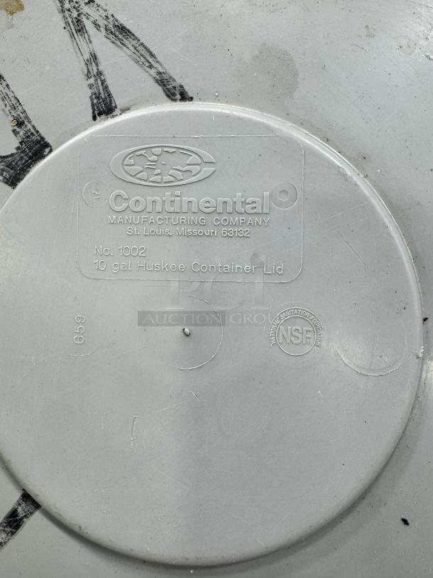 Continental plastic trash can lid, model 1002, 10-gallon, NSF certified, used condition with visible markings.
