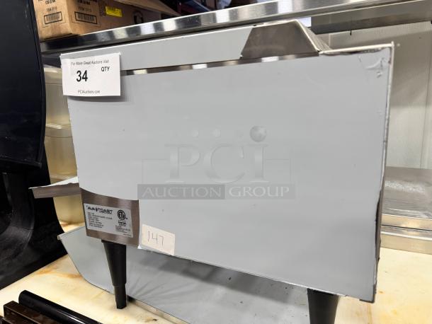 AvaToast CTA 7001 tabletop conveyor toaster, brand new, silver finish, ETL certified, model tag visible, pristine condition.
