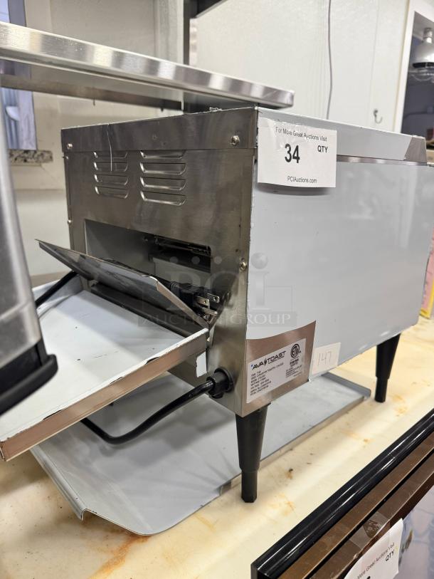 AvaToast CTA 7001 Tabletop Conveyor Toaster, brand new, stainless steel finish, with power cord, model label visible.