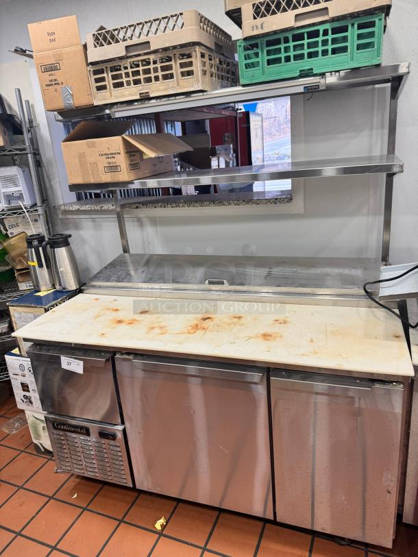 Continental 68" pizza prep-table with overhead shelf, stainless steel, tested and working, visible wear on surface.